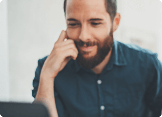 Man seated looking at computer